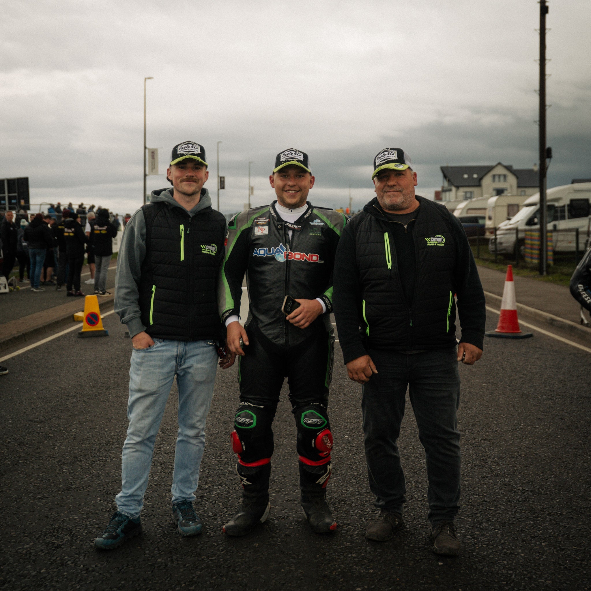 motorbike riders wearing white and green trucker hats at the north west 200