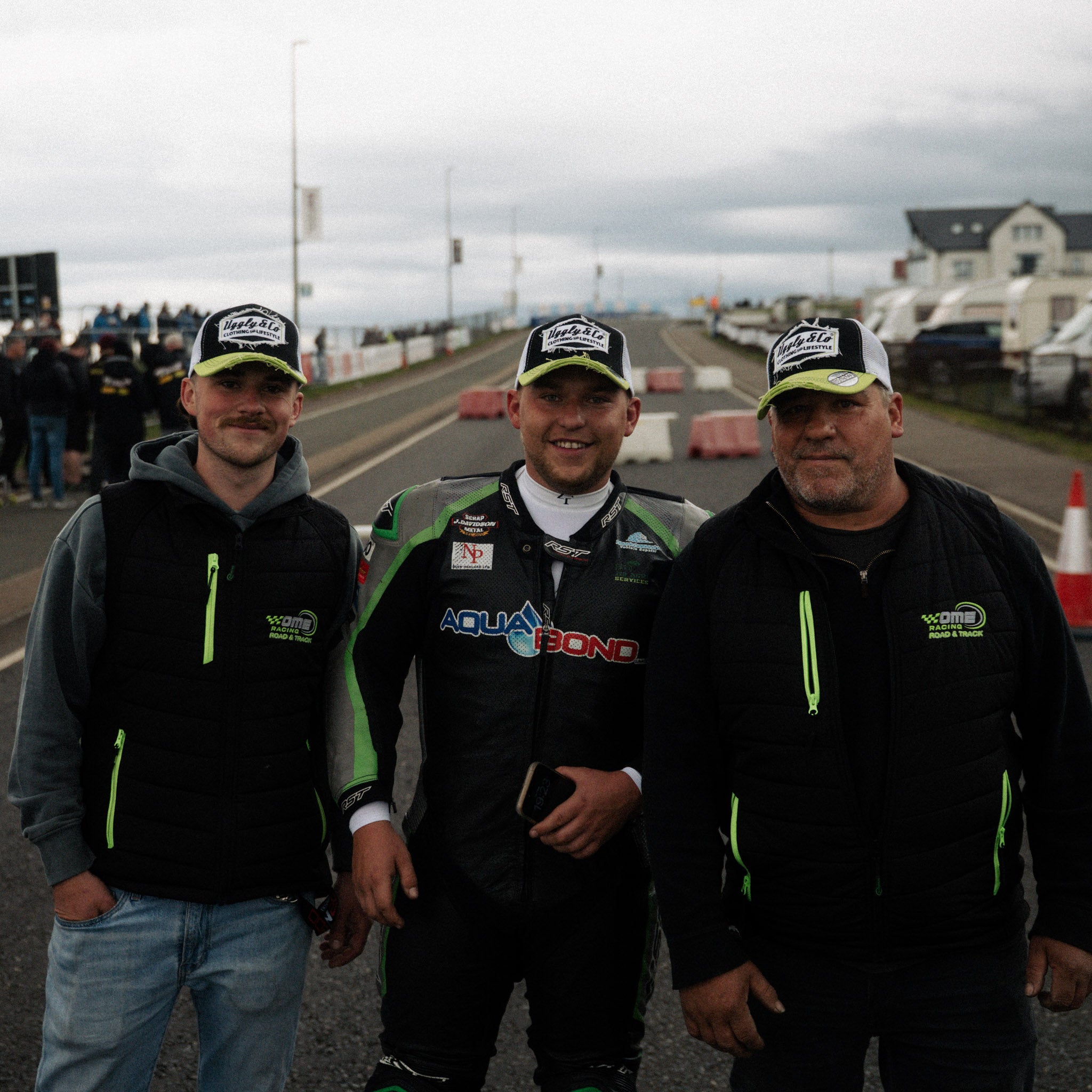 motorbike riders wearing black and green trucker hats at the north west 200