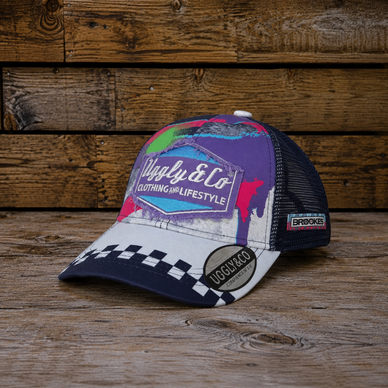 Josh Brooks x 80s Vintage Motocross Diamond Cap with purple, white and checkered racing design on a rustic wooden background.