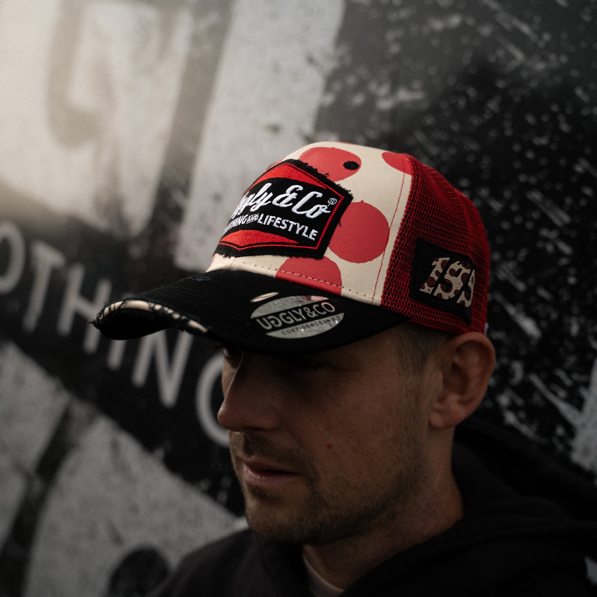 Pierre Yves Bian in red and white trucker hat side profile