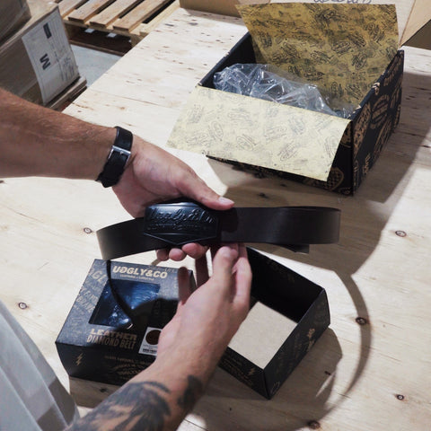 product unboxing of the leather diamond belt, showing the packaging, design and product details.