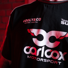 Close up of the front logo on a Carl Cox motorsport and Team Classic Suzuki black and red t-shirt