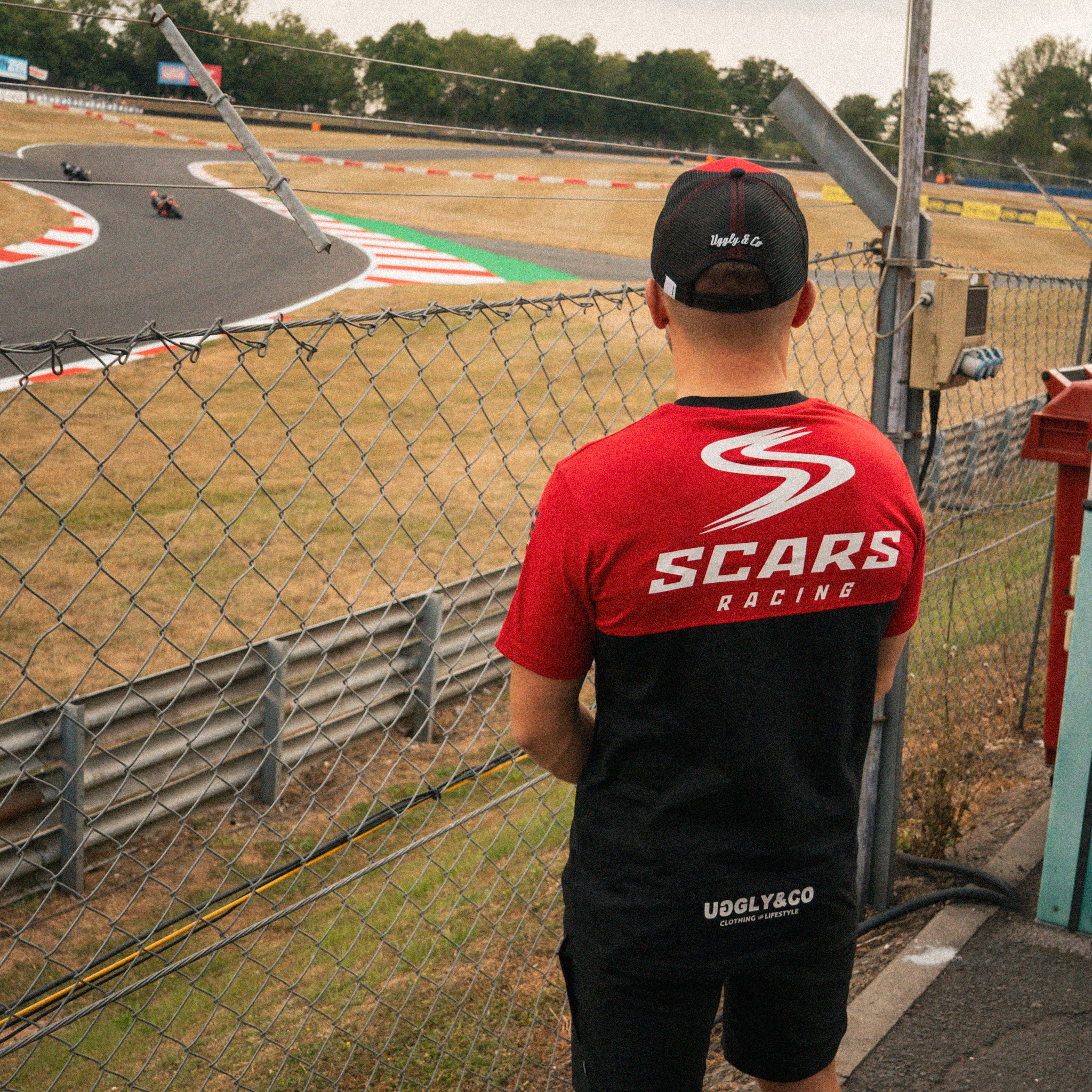 Luke Stapleford wearing the Scars Racing T-shirt at the racetrack