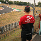 Luke Stapleford wearing the Scars Racing T-shirt at the racetrack