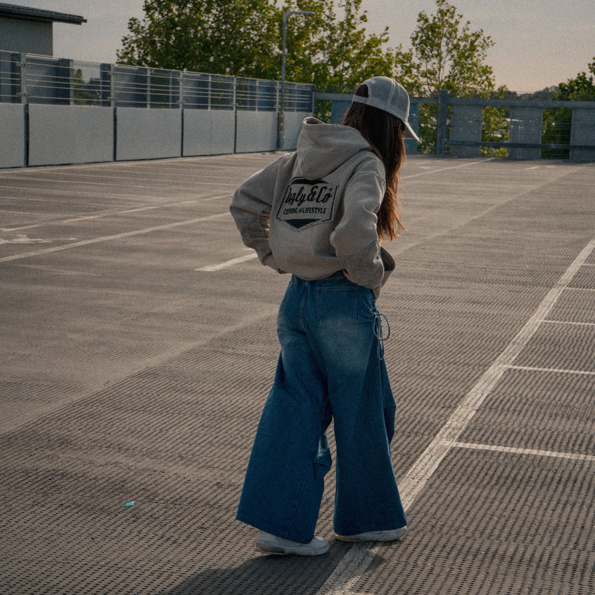 Female fashion styling with the Silver & Grey Diamond Trucker Hat