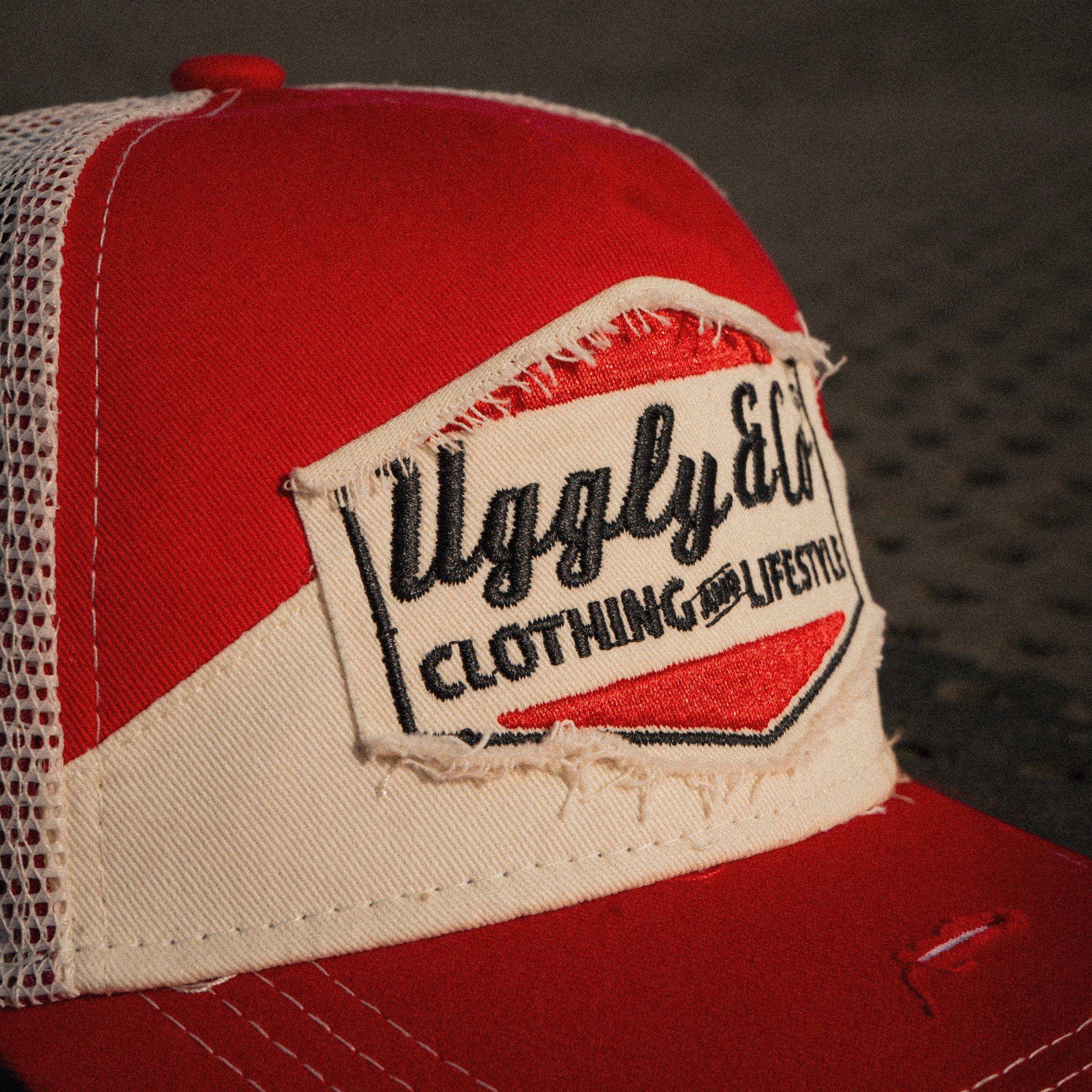 Close up of the red label and Diamond logo on the Smokin’ Trucker Hat. Marlboro inspired  cap.