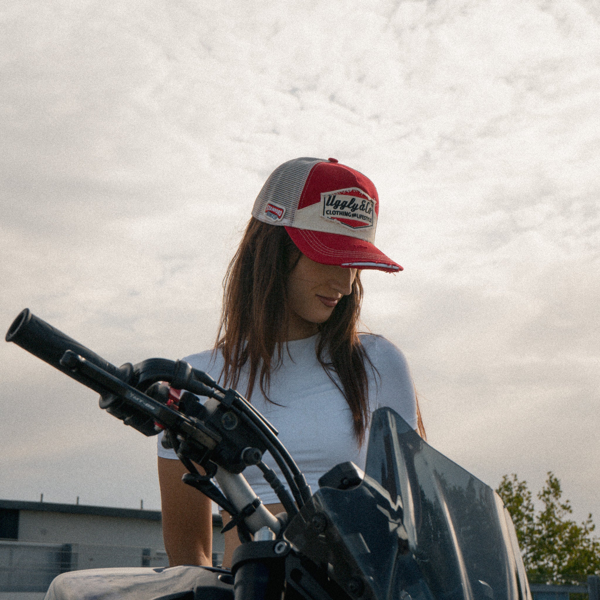Lifestyle image featuring the Smokin’ Red Label Diamond Trucker Hat. Marlboro cap.
