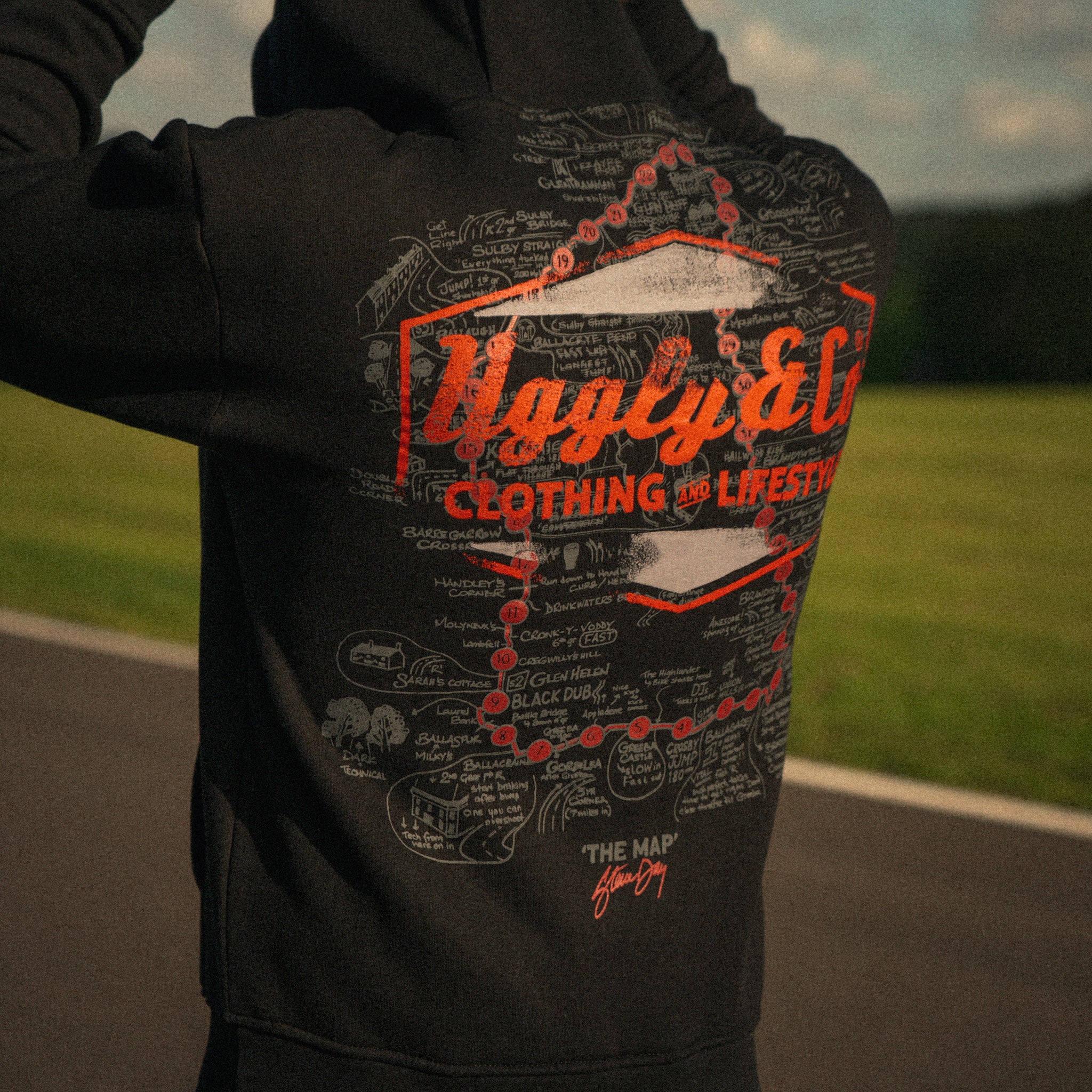 Steve Day The Map black hoodie in a Donington Park motorsport setting, worn by BSB rider Josh Brookes