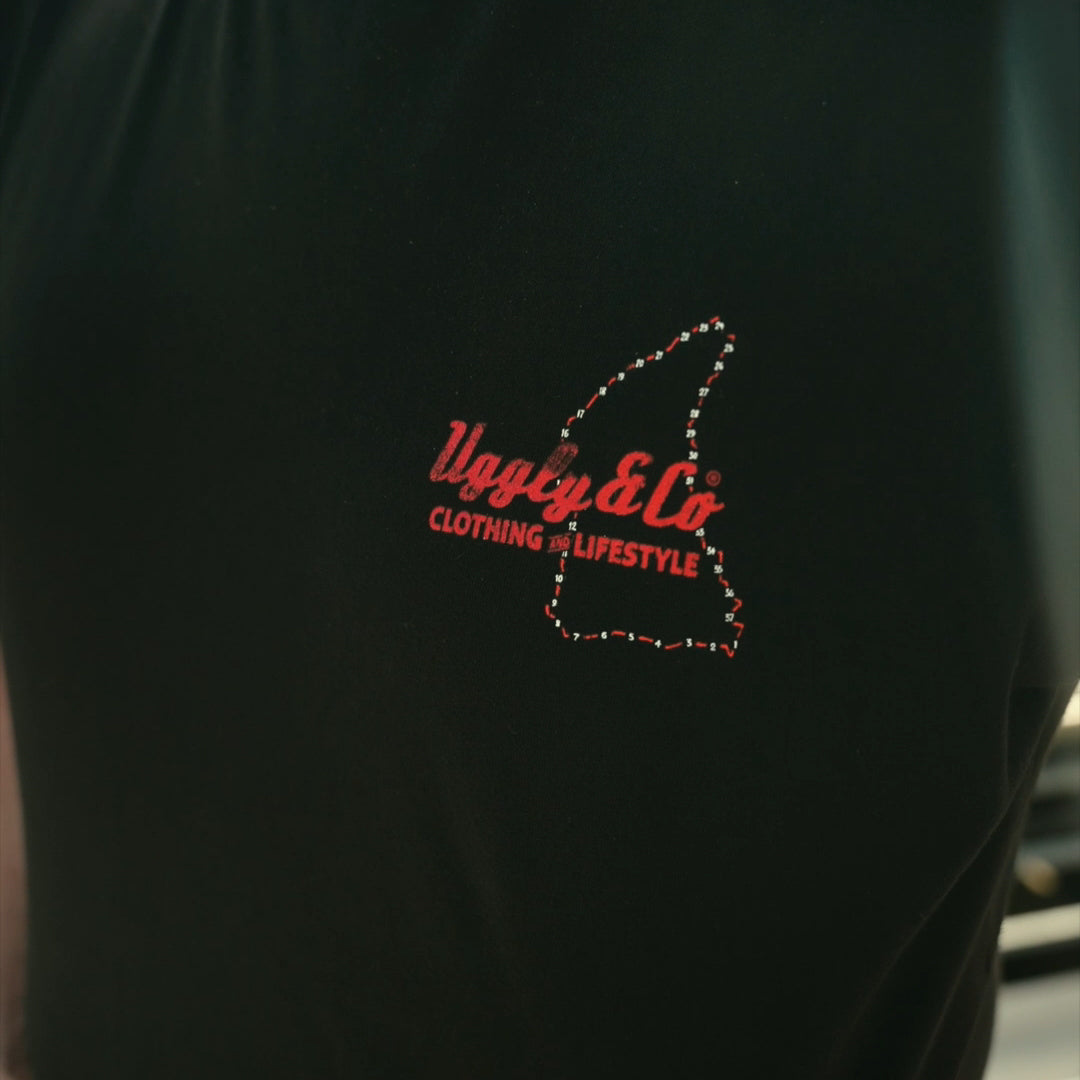 Close product shot of the black Steve Day ‘The Map’ T-shirt with TT inspired design