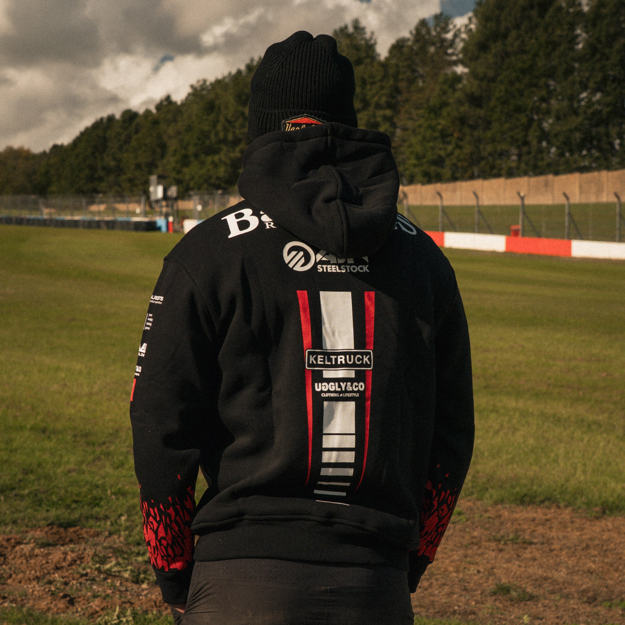 Back view of Storm Stacey wearing the Bathams Racing x AJN Steelstock Road Racing Hoodie trackside