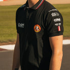 Close-up of the chest logos on the Bathams Racing x AJN Steelstock Road Racing Polo worn by Storm Stacey