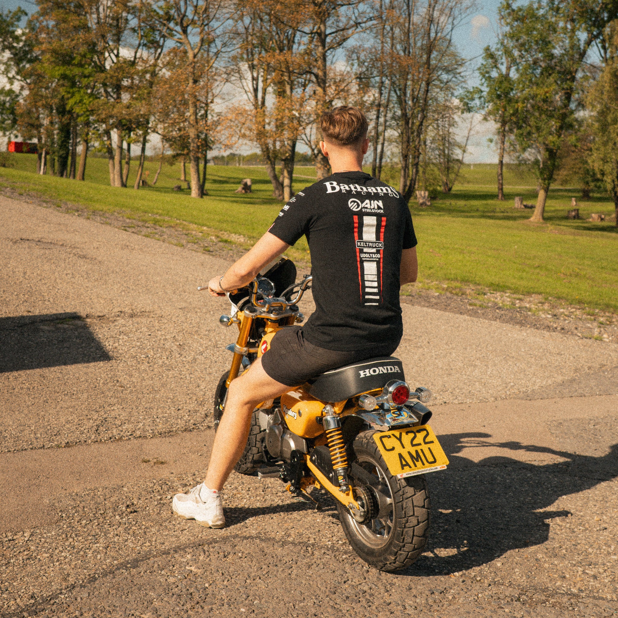 back view of baths racing t shirt worn by storm stacey on his monkey bike
