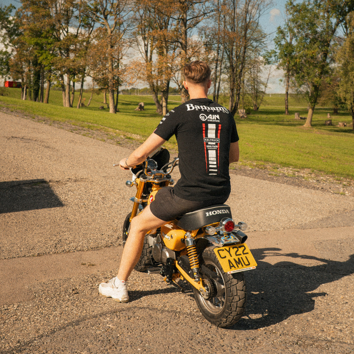back view of baths racing t shirt worn by storm stacey on his monkey bike