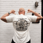 Rear view of Tom Kerridge wearing a Butchers Tap and Grill white t-shirt with black graphics and text