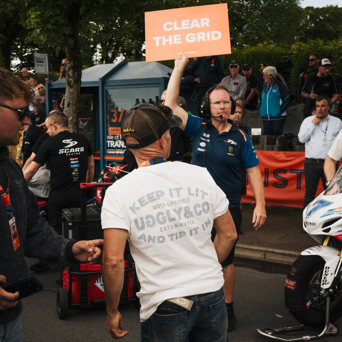 uggly and co founder on tt grid in white motorbike t shirt