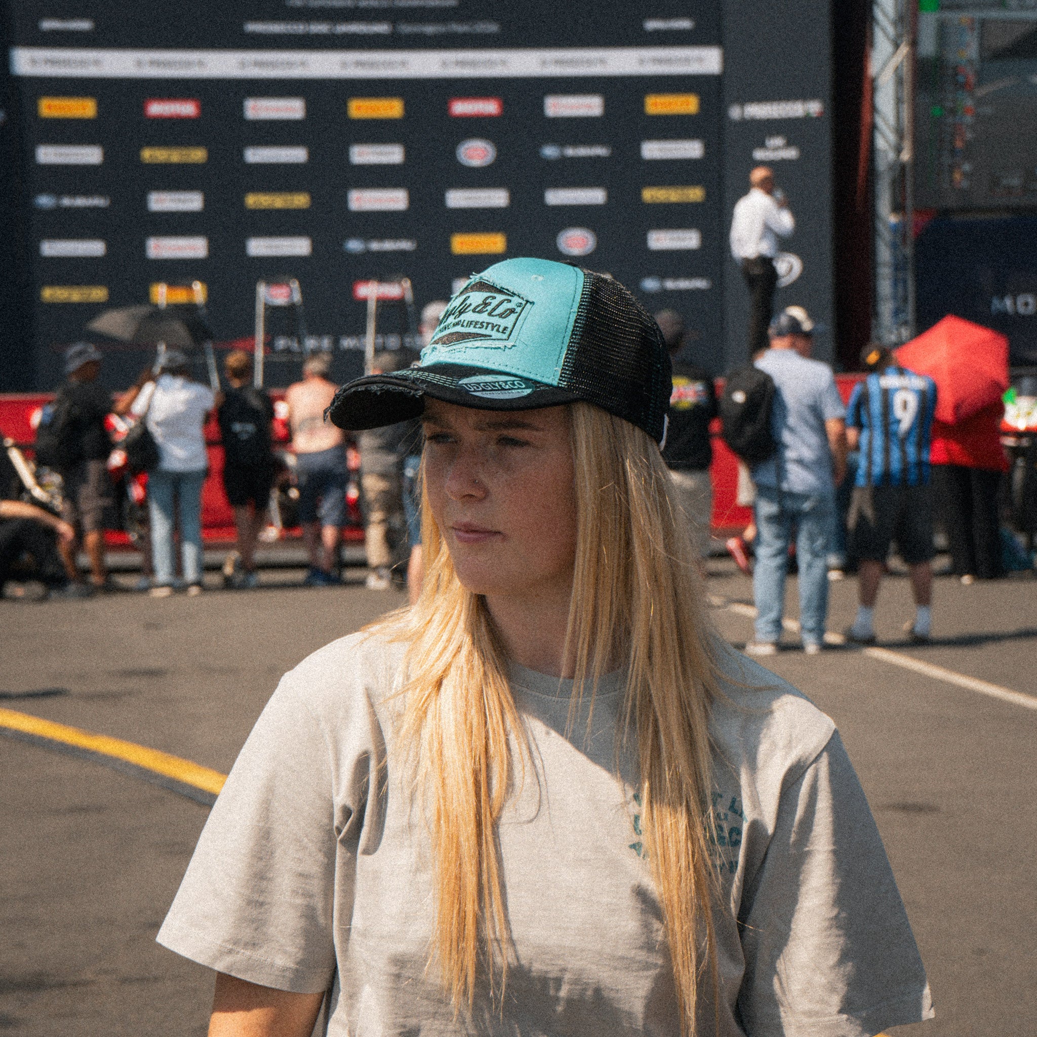 Chloe Jones wearing the Uggly&Co Turquoise and Black Diamond Cap at the racetrack