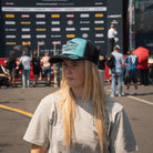 Chloe Jones wearing the Uggly&Co Turquoise and Black Diamond Cap at the racetrack