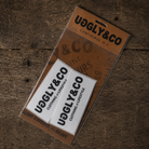 Uggly&Co Clothing & Lifestyle Sticker Pack containing two white stickers featuring the iconic black Uggly&Co logo.