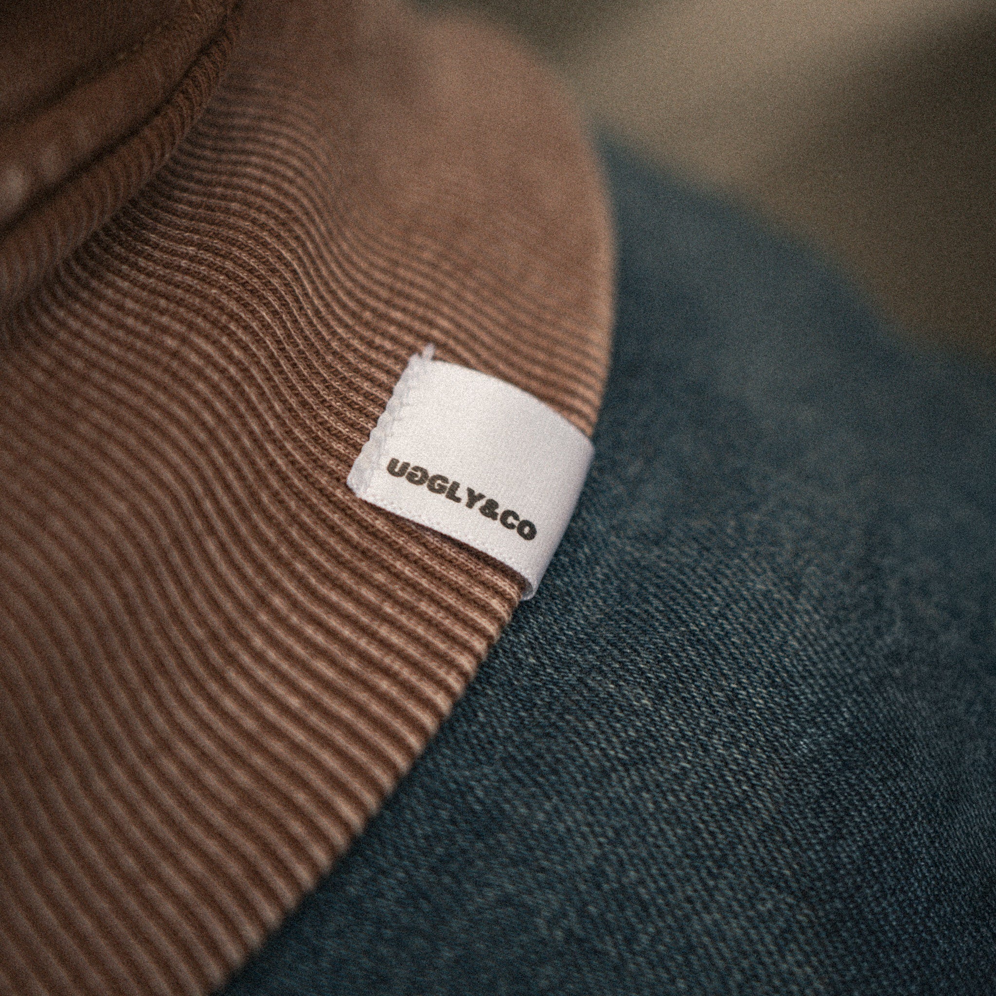close up of uggly and co logo on hoodie