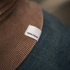 close up of uggly and co logo on hoodie