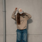 Female model wearing the Uggly & Co Silver & Grey Diamond Trucker Hat