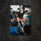 Close up of the Uggly & Co TT race bike in the garage, showing the fairing and livery details, displayed as canvas wall art.