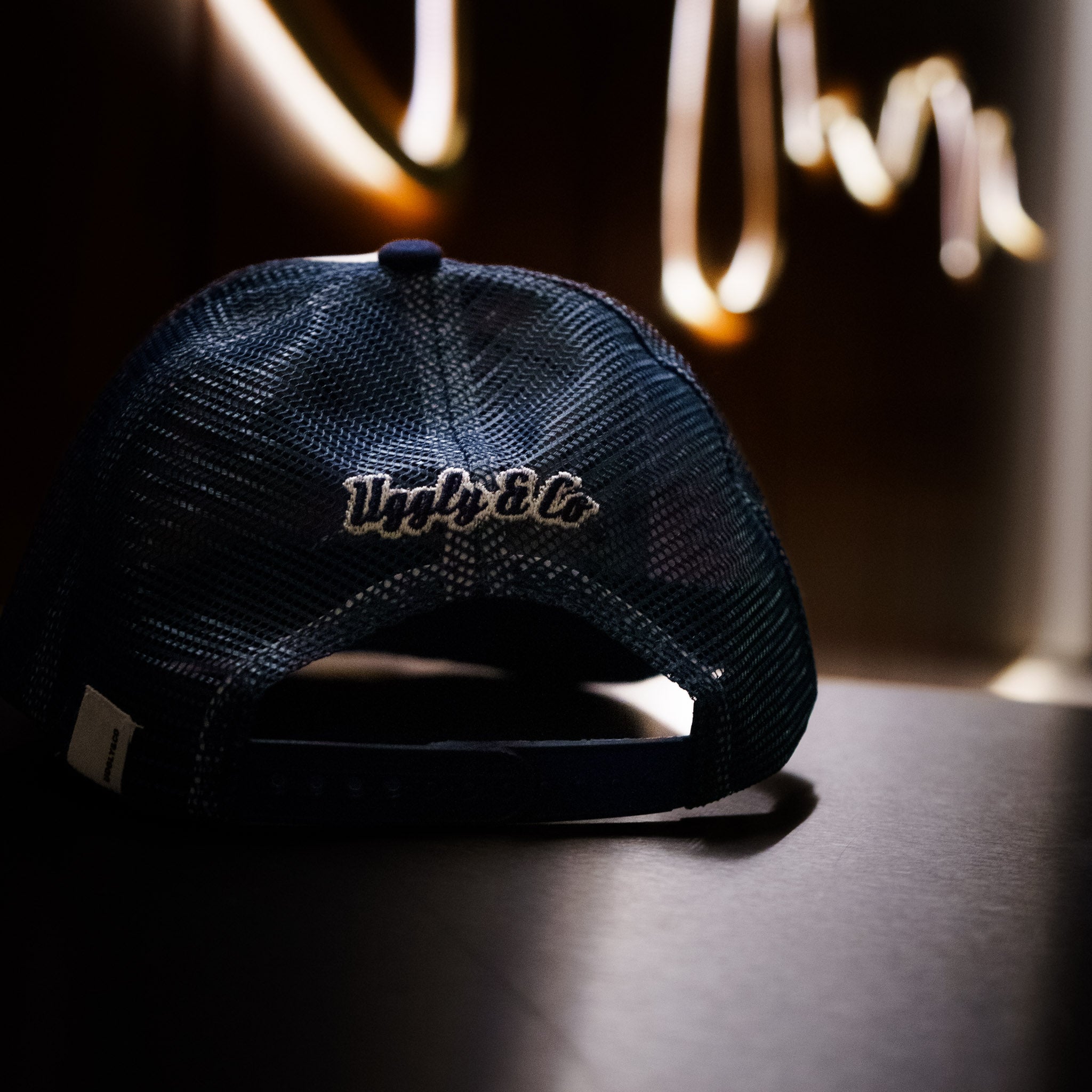 Uggly & Co Navy Blue & White Diamond Trucker Hat back logo