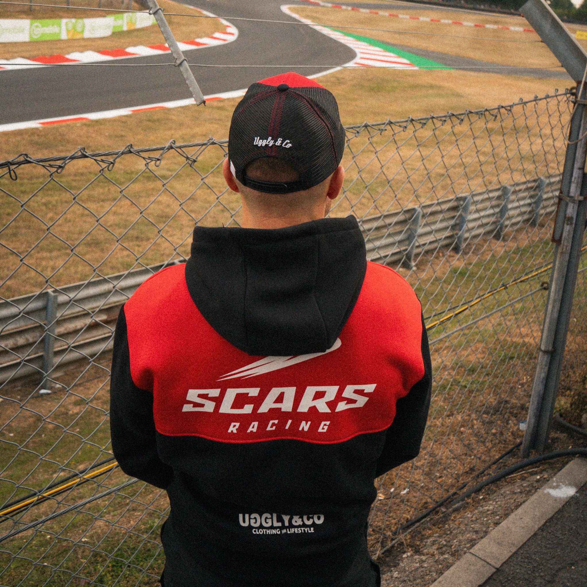 Luke Stapleford wearing the Scars Racing hoodie at the racetrack