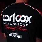 Close up of the back logos on a Carl Cox motorsport and Team Classic Suzuki black and red t-shirt