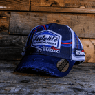 Team Classic Suzuki trucker hat on blue, red and white, with a mesh back and an Uggly&Co diamond logo on the front