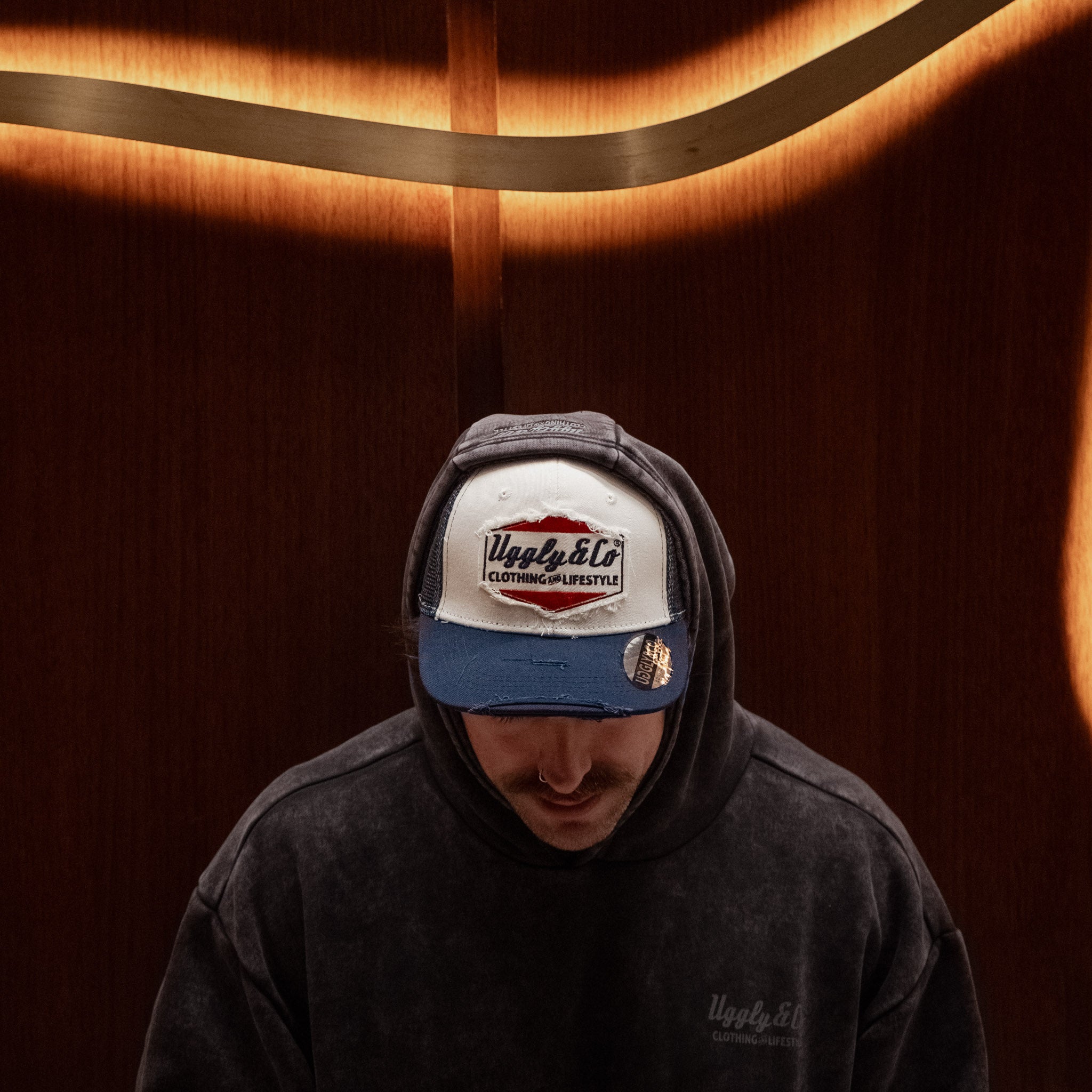 Wendigo wearing the Navy Blue & White Diamond Trucker Hat