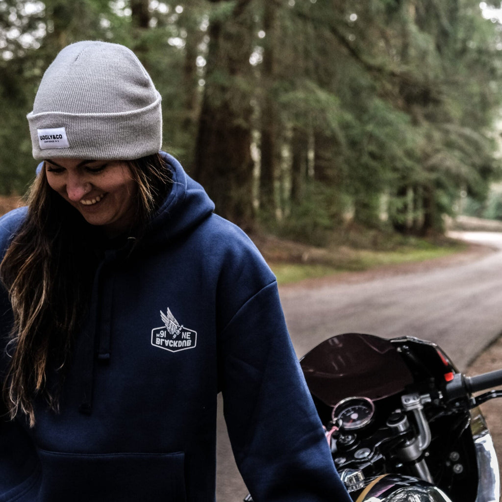 A Uggly&Co light grey heather beanie on the tank of a Royal Enfield on a unique photoshoot with @wreckitwren on instagram